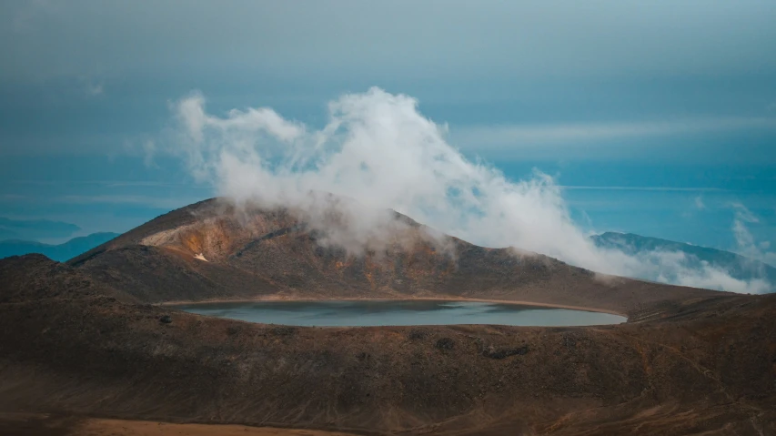 a lake and some mountains in the distance