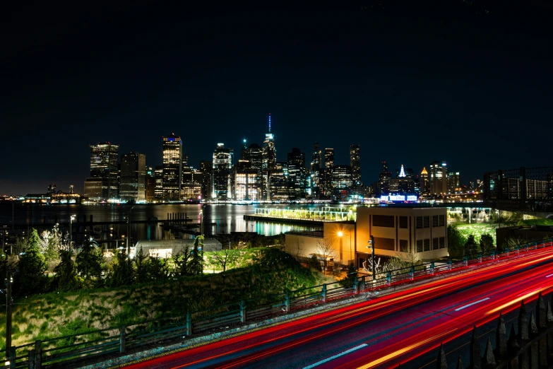 a cityscape lit up at night with streaks of light