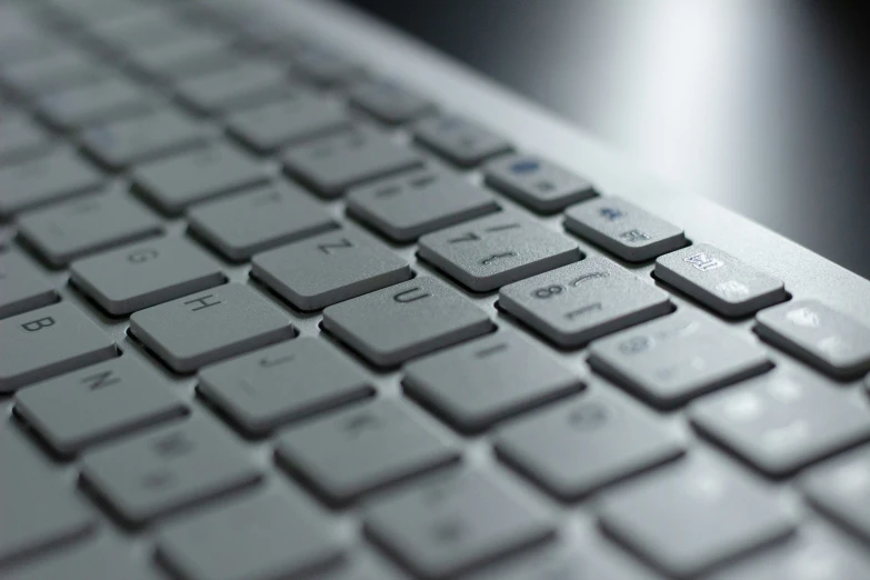 a close up view of a keyboard on the desk