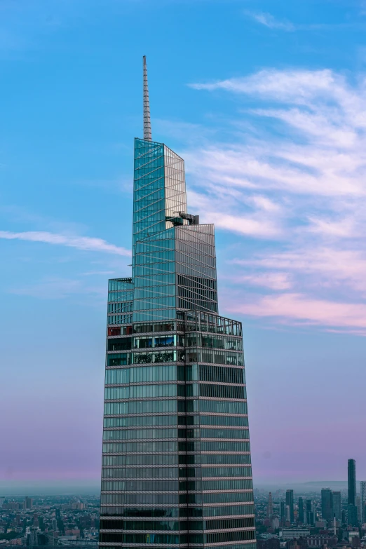 an extremely tall building standing alone in the distance