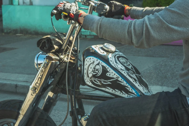 a person in black pants sitting on a bike