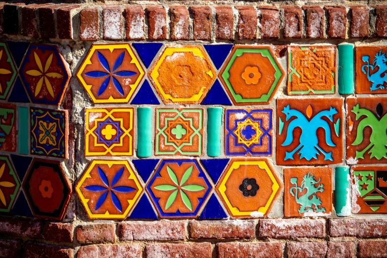 some colorful tiles on the side of a building