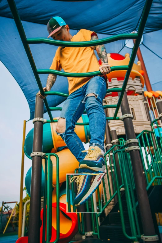 a man riding a skateboard on the side of a slide