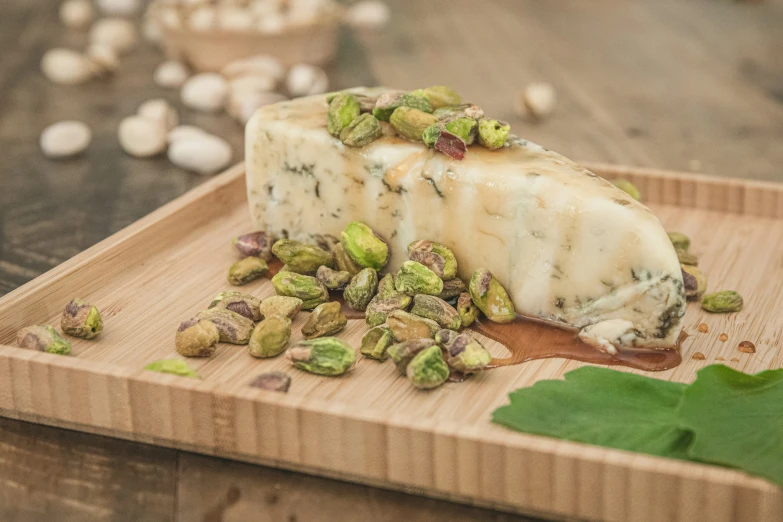 brussel sprouts sitting on a  board with a piece of cheese