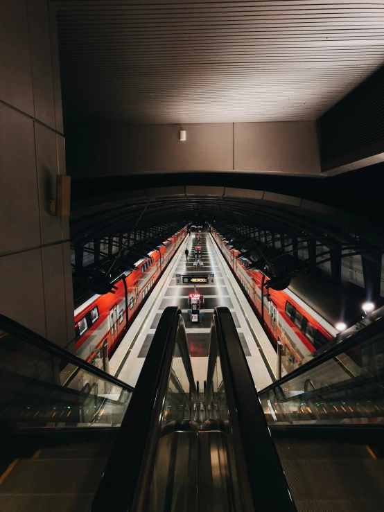 view of the escalator and platforms at a station