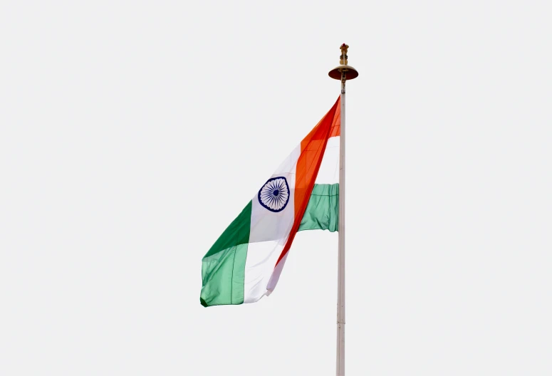 a flag with the national colors flying next to a flag pole