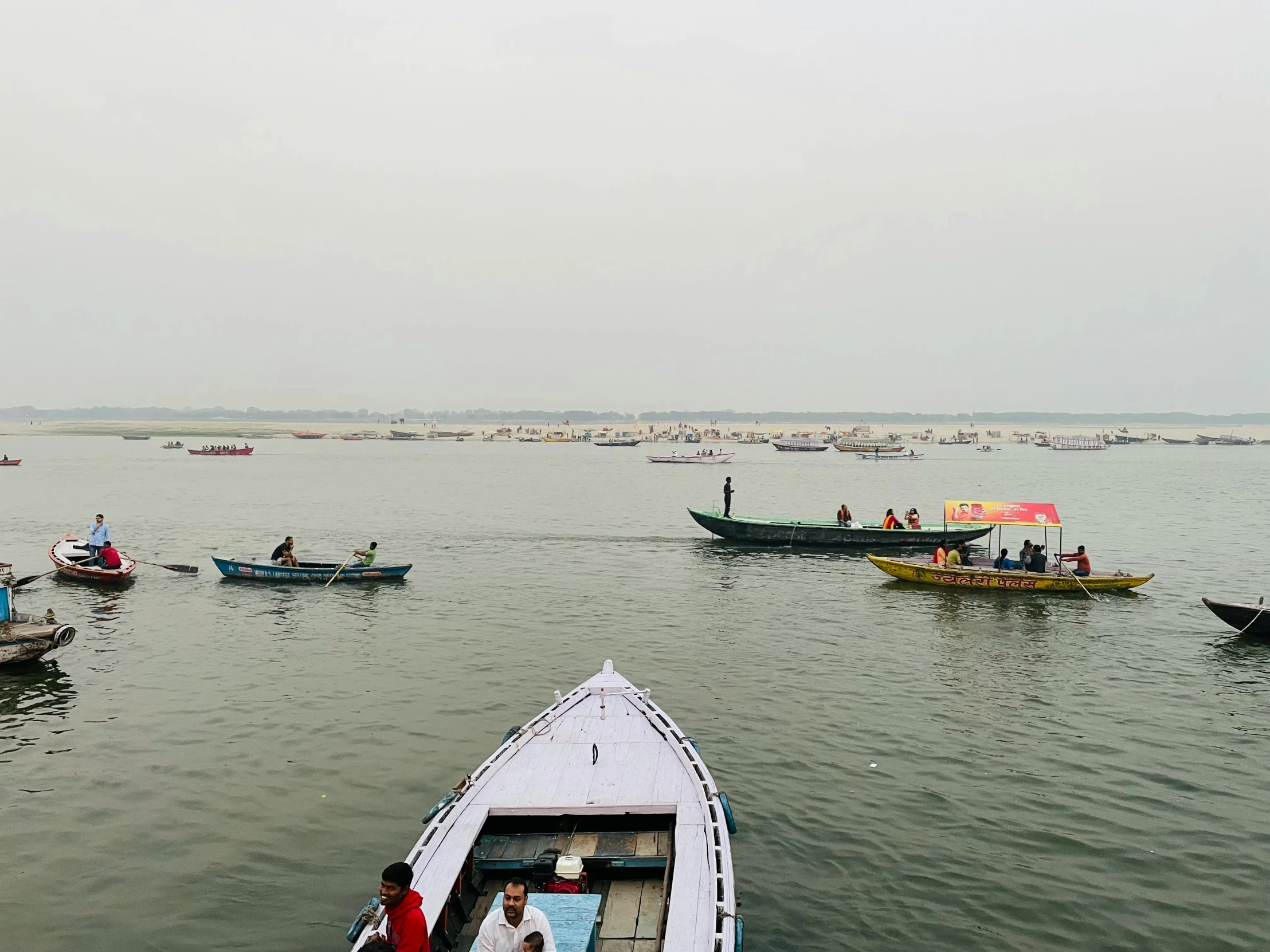 a large body of water with several small boats floating on it