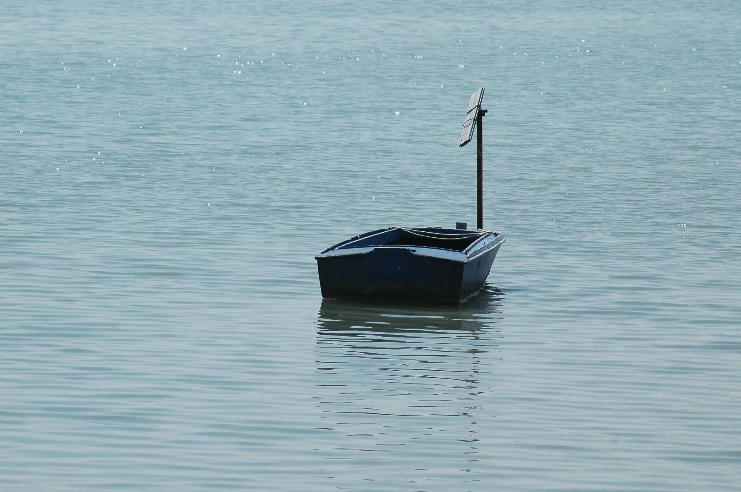 a small boat is in the calm waters