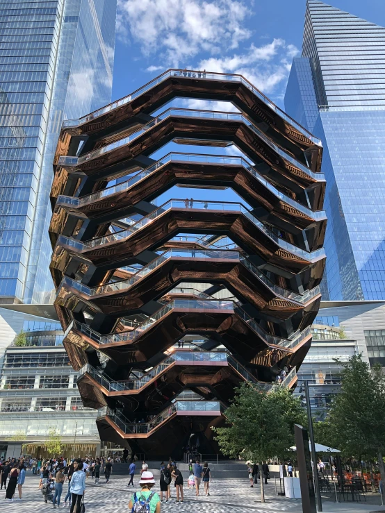 a very tall building with lots of wooden stairs