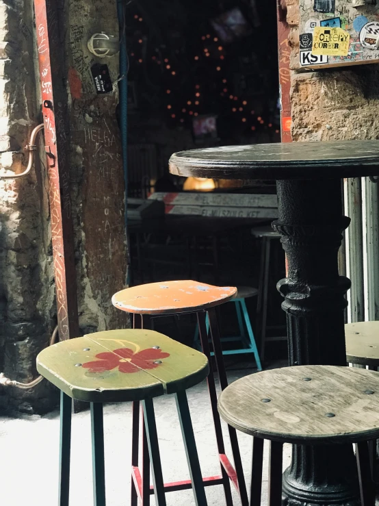 four stools in an outdoor sitting area