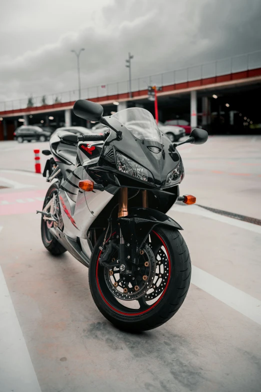 the motorbike is parked in front of a red building