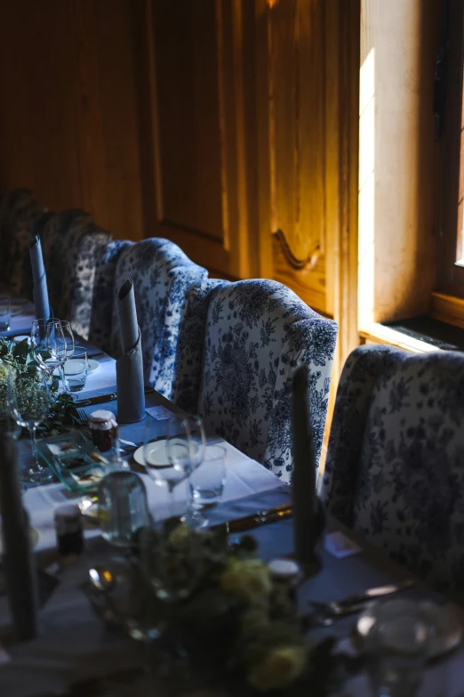 a dining room with tables set for dinner