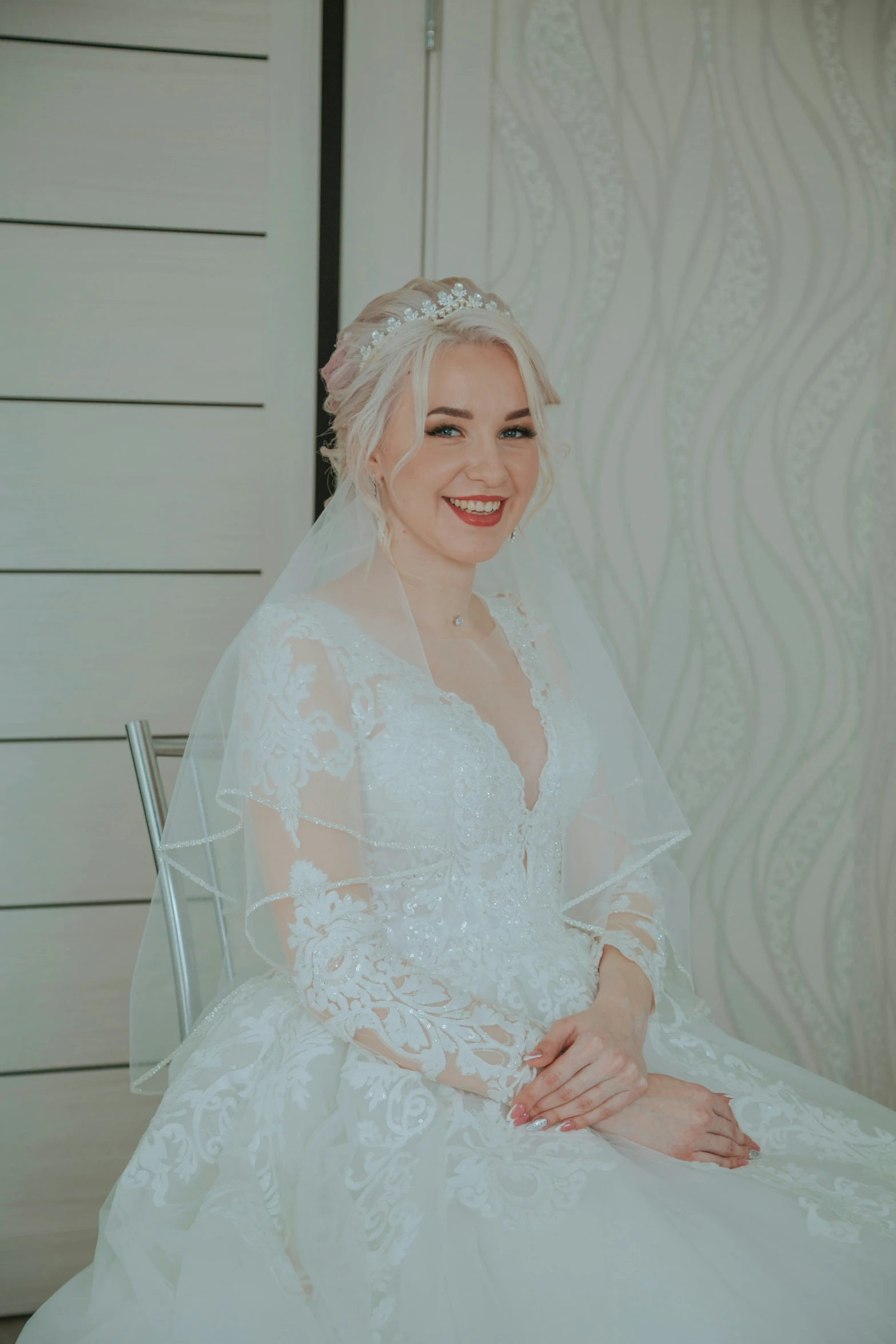 a bride wearing a white gown and a veil