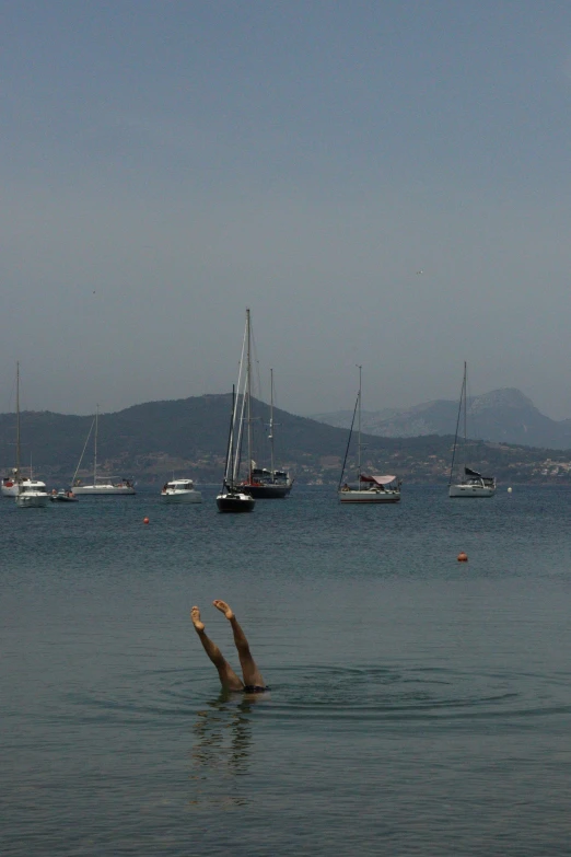 the body of water is calm as the ships go by