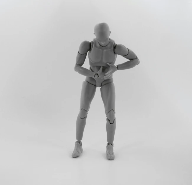 a mannequin looking at it's back with its hands on the hips