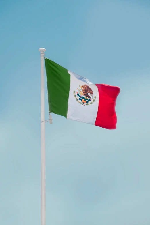 a waving flag in a bright blue sky