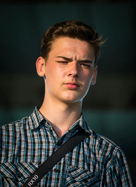 a young man has his eyes closed and stares in an attempt to control his self