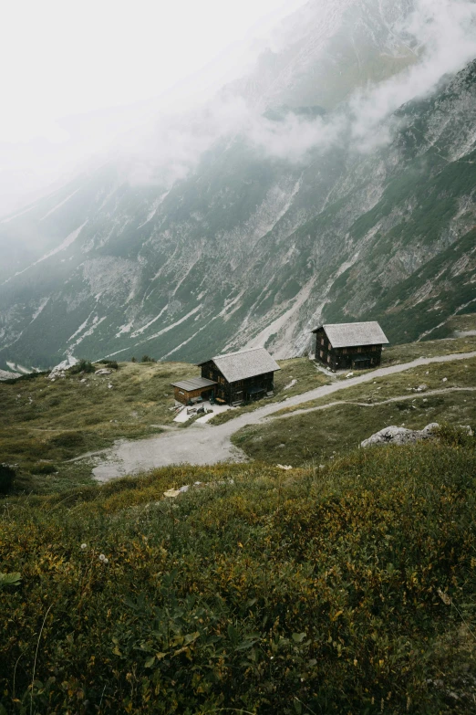 two small houses on the top of the mountain