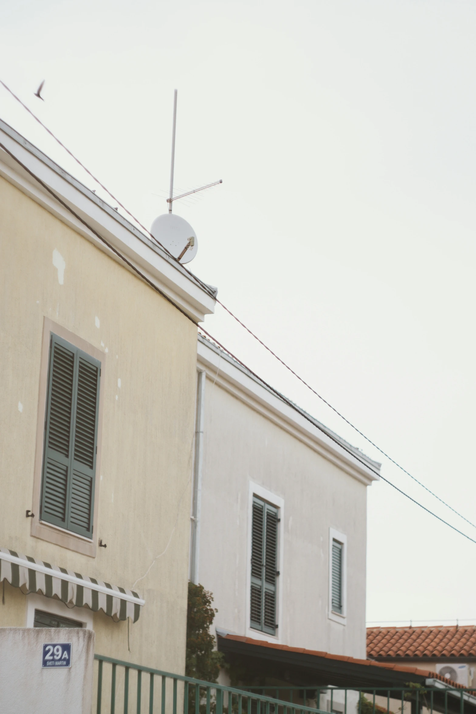 two buildings next to each other with windows on them