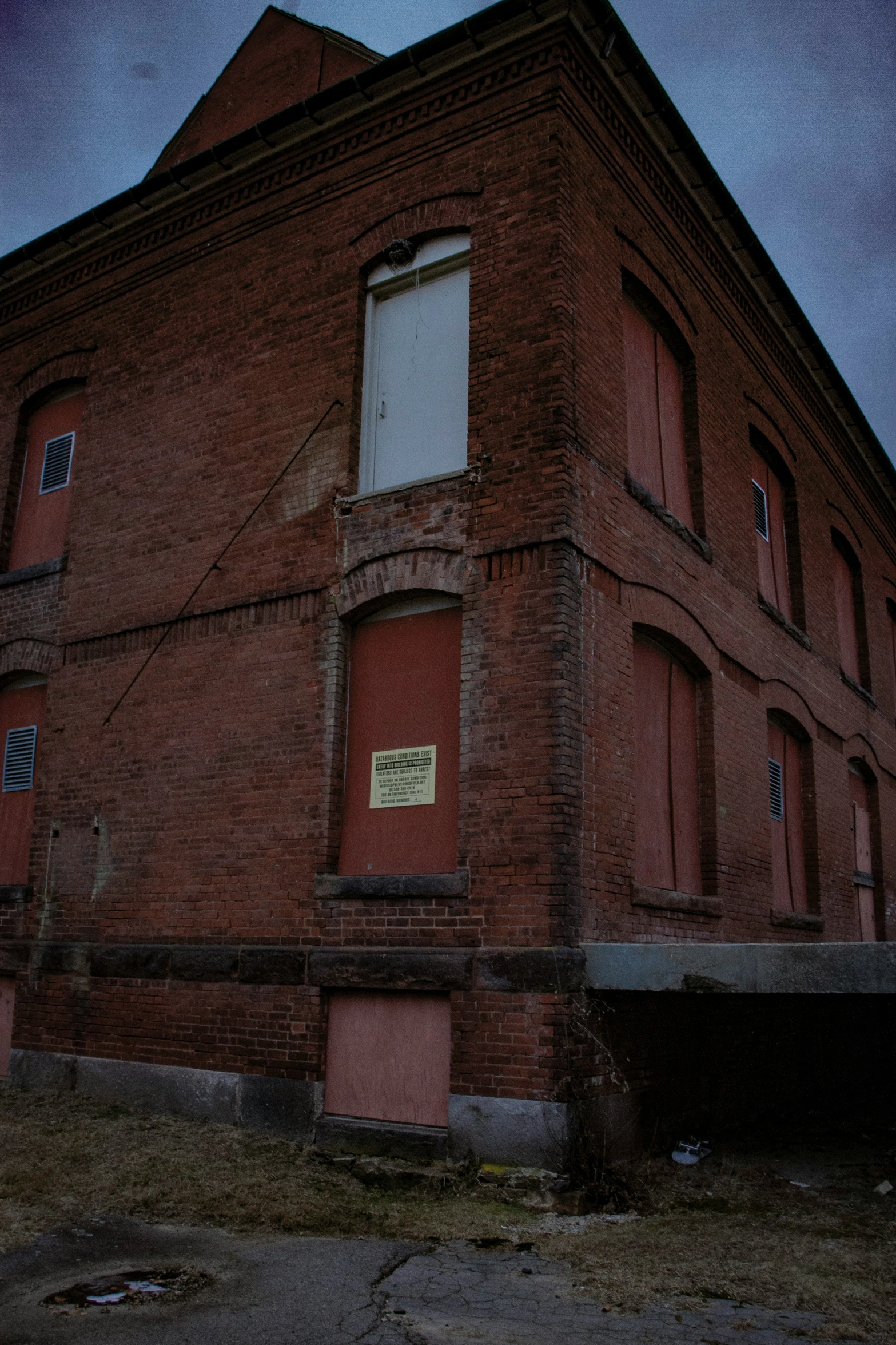 an old red building with the name sign of a restaurant on it