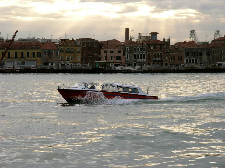 there is a boat that is riding on the water