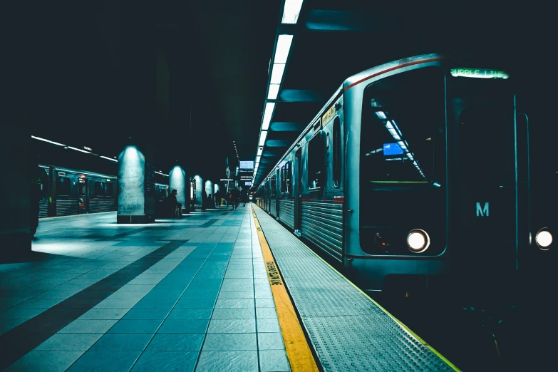 a train moving through a station with two lights