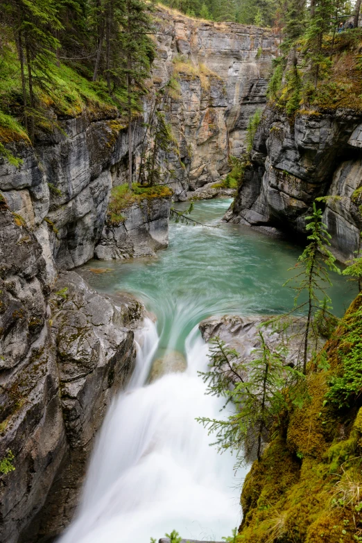 a waterfall with many waterfalls flowing from it