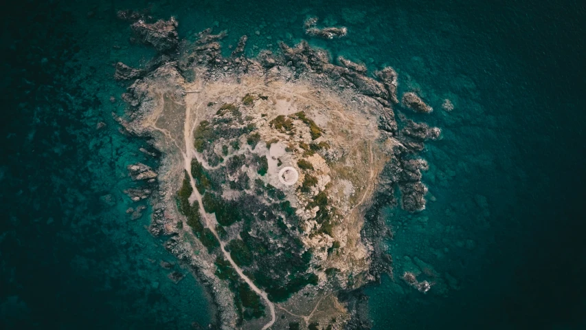 an aerial view of an island is shown in the sea