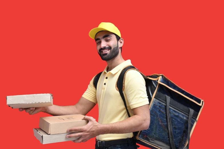 a delivery man carrying boxes and a laptop