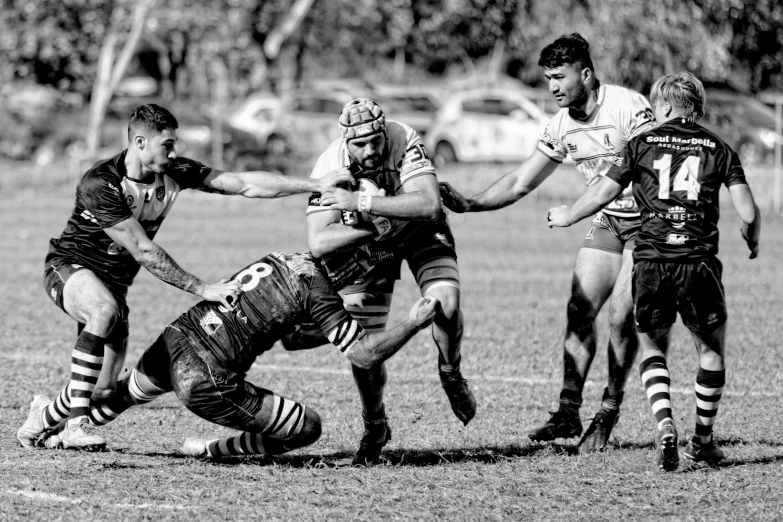 two teams of rugby players going for the ball