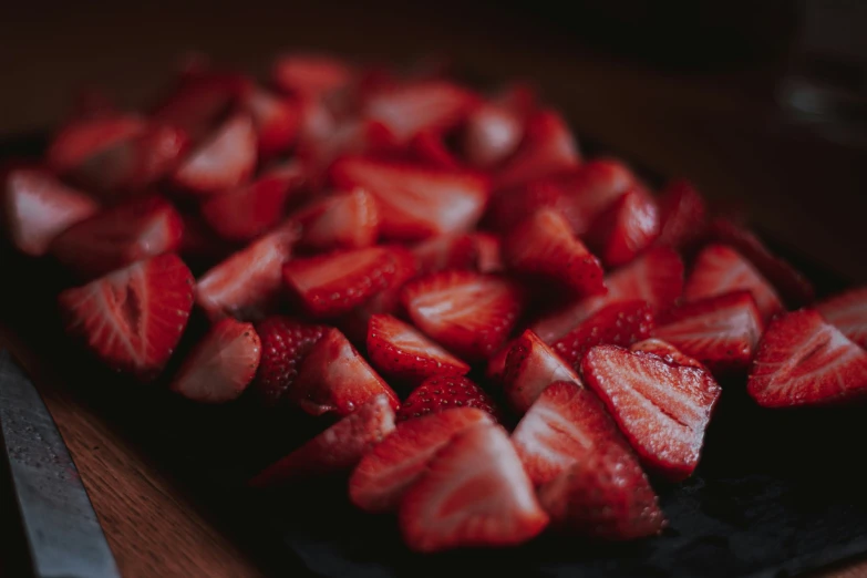 sliced up strawberries arranged in a decorative pattern