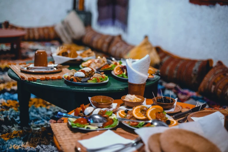 a table with many plates of food on it