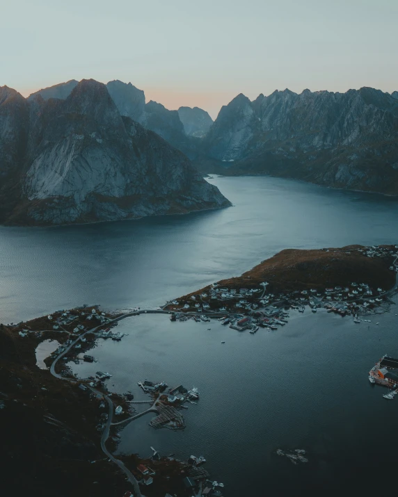 a body of water with some mountains in the background