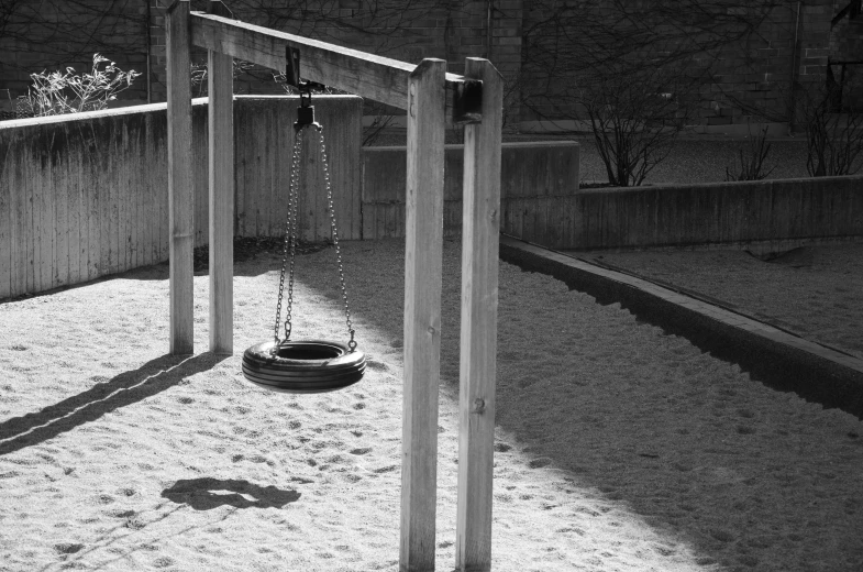 black and white po of a swing set