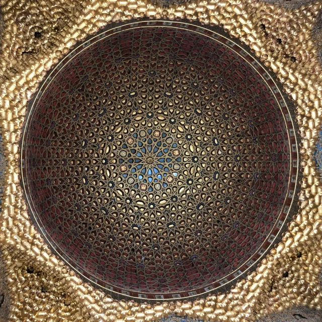 a mosaic tile with an intricate circle pattern