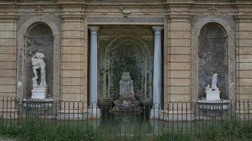 the entrance to a beautiful building with statues