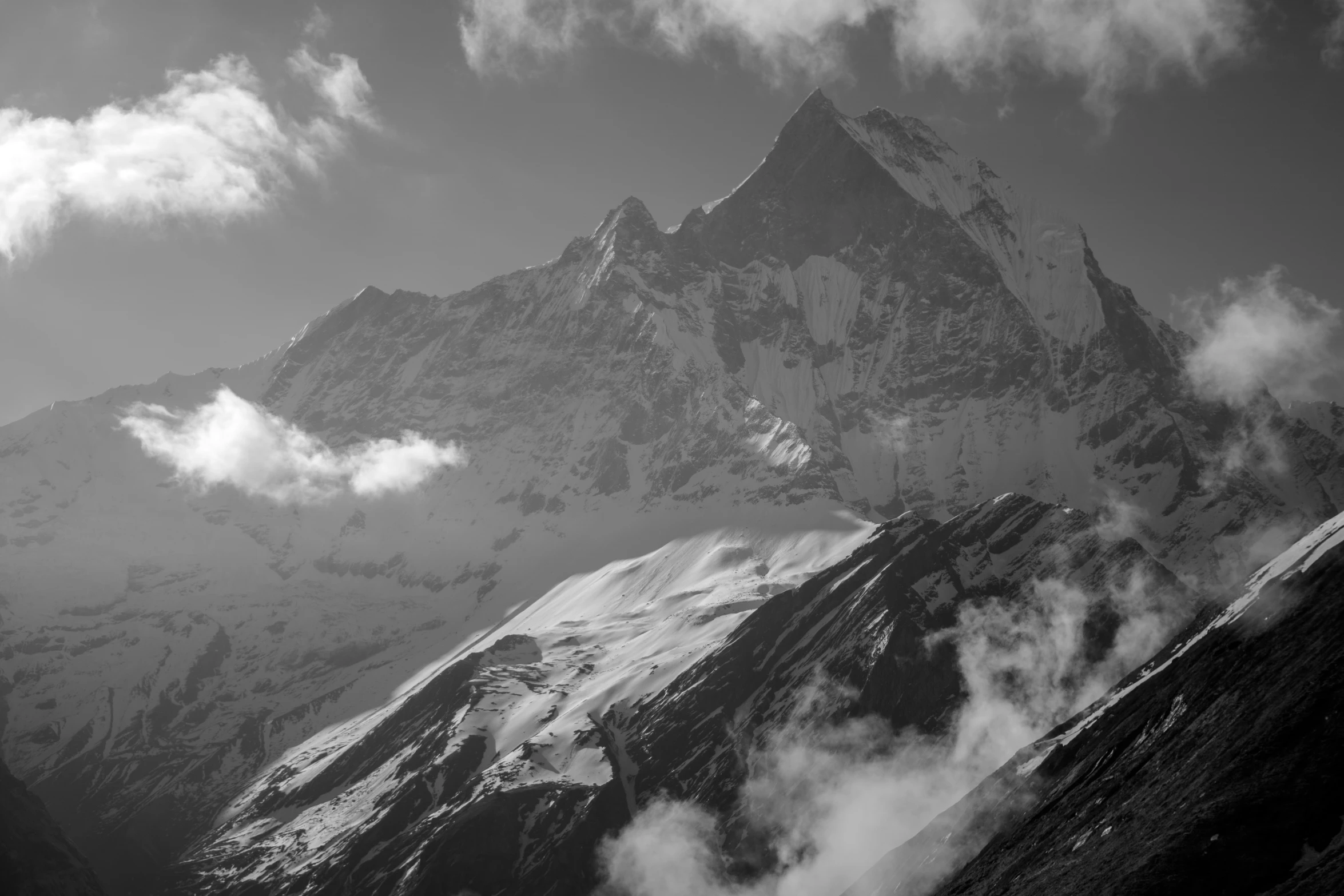 an image of clouds forming over a mountain range