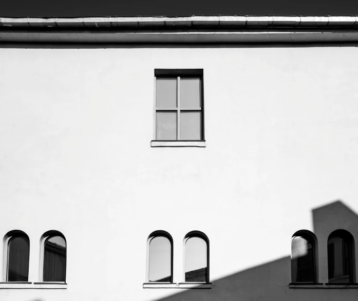 an image of the side of a building with several windows