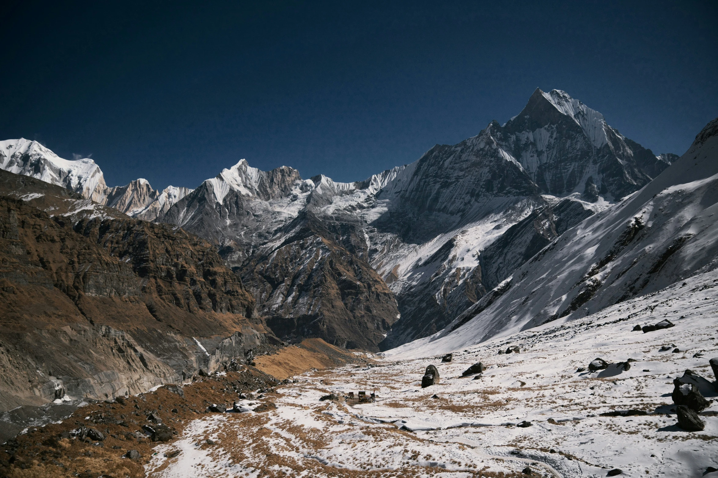 mountains with snow and grass near each other