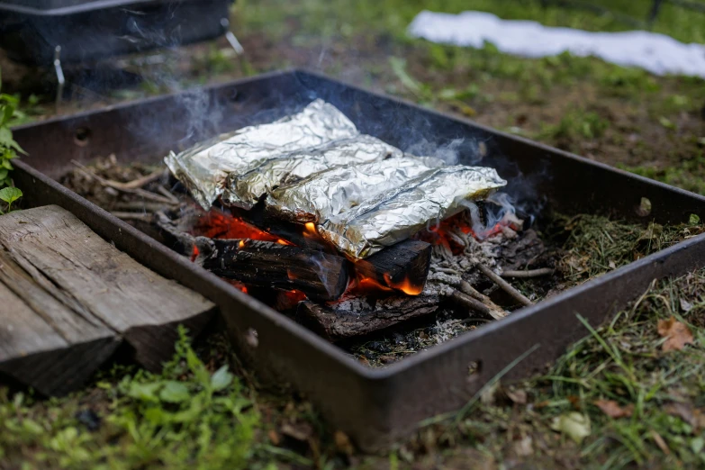 a grill with foil wrapped in tin foil