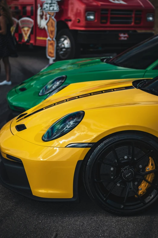 a close up of a yellow and green sports cars