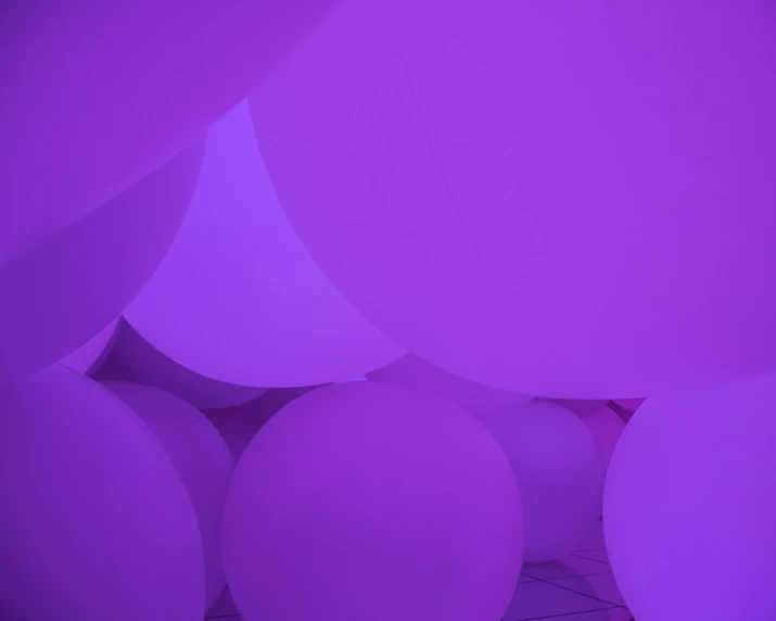 a room with a bunch of balloons floating around