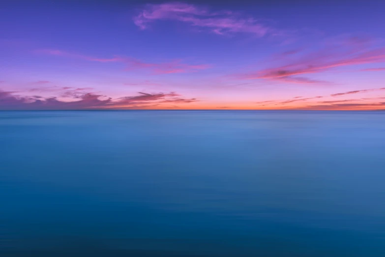 a long exposure s of the ocean at sunset