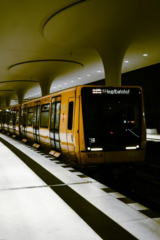 a subway train pulls into a very empty station