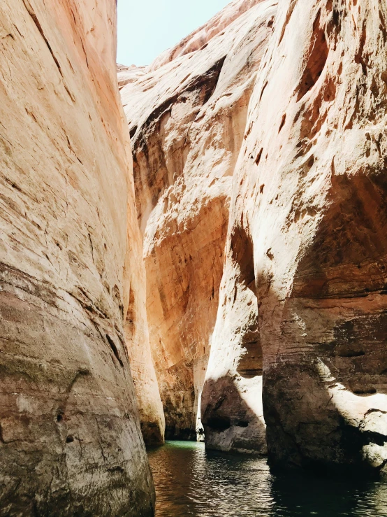 a narrow gorge leading to some rocks and water