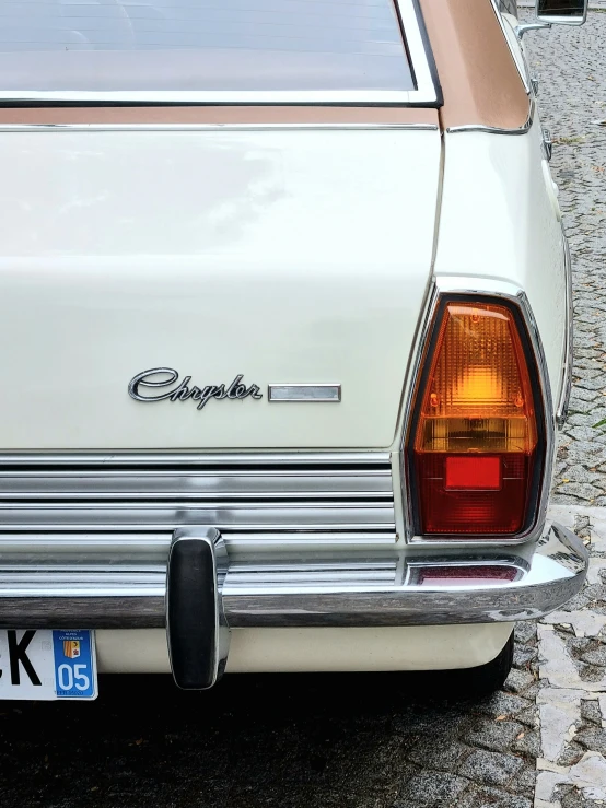 a white car parked next to a curb