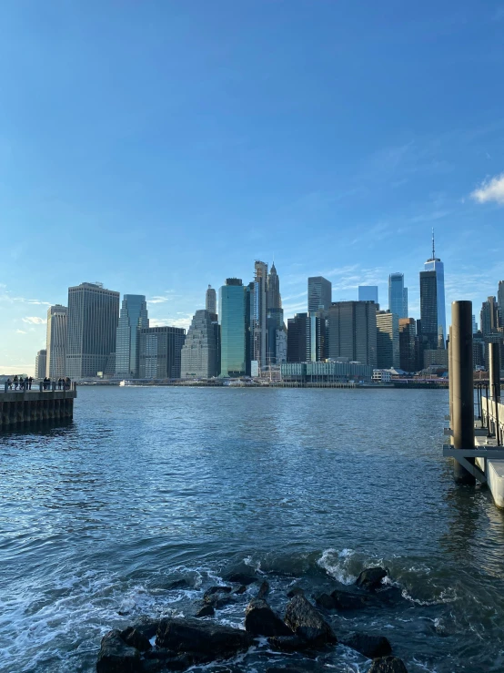 a city from the water with lots of tall buildings