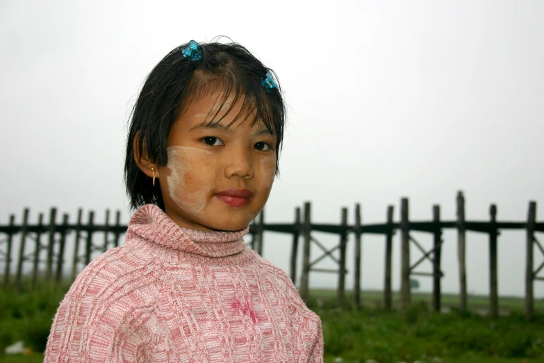 a close up of a young child with a face and hair