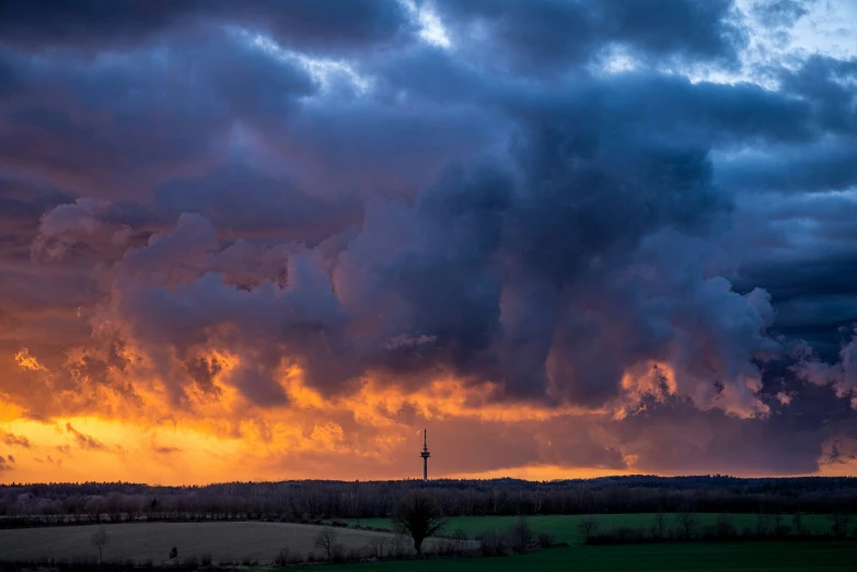 a cloudy sky with many clouds above the ground