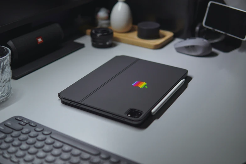 a laptop sitting on top of a white desk